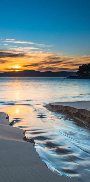 lever de soleil doux sur la mer, invitant à retrouver la joie de vivre